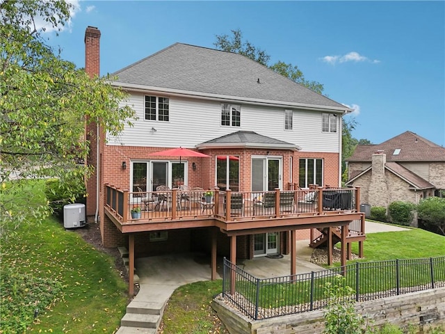 308 Heather Hill Dr, Pine Twp, PA 15044 - back of property with a wooden deck, a patio, brick siding, and a fenced backyard
