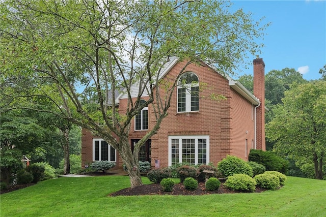 308 Heather Hill Dr, Pine Twp, PA 15044 - back of property with a chimney, a yard, and brick siding