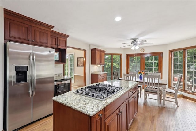 308 Heather Hill Dr, Pine Twp, PA 15044 - kitchen featuring stainless steel appliances, ceiling fan, light wood finished floors, healthy amount of natural light, and recessed lighting