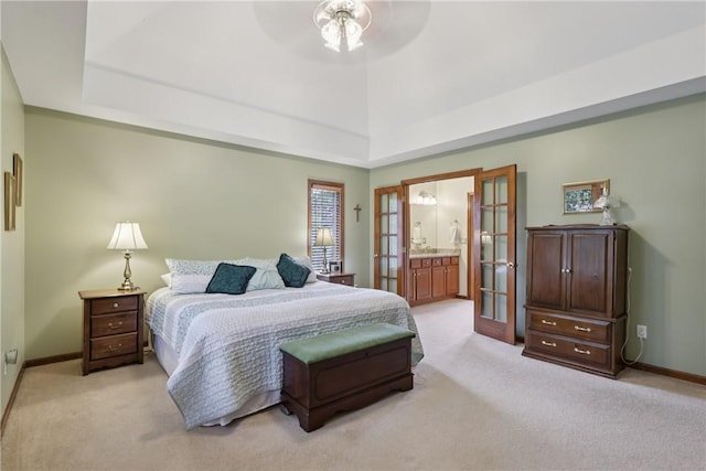 308 Heather Hill Dr, Pine Twp, PA 15044 - bedroom with a tray ceiling, light carpet, french doors, and connected bathroom