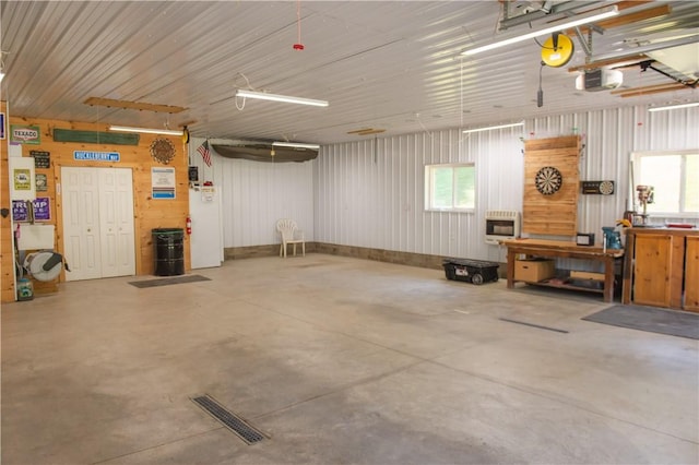 113 Betty Ln, Butler, PA 16002 - garage featuring heating unit, a workshop area, and a garage door opener