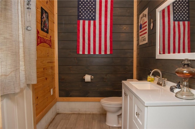 113 Betty Ln, Butler, PA 16002 - half bath featuring vanity, wood walls, and wood finished floors