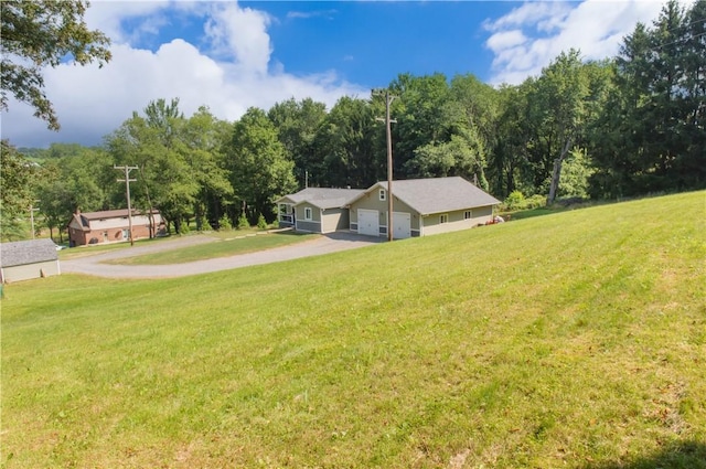 113 Betty Ln, Butler, PA 16002 - view of green lawn featuring an attached garage and driveway