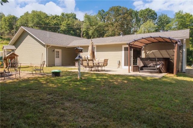 113 Betty Ln, Butler, PA 16002 - back of property featuring a hot tub, a patio area, a yard, a playground, and a shingled roof