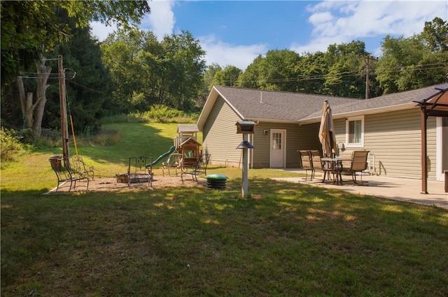 113 Betty Ln, Butler, PA 16002 - back of property featuring a playground, a lawn, a patio, and an outdoor fire pit