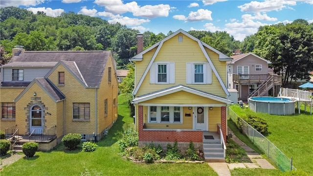 1804 Ridge Ave, Coraopolis, PA 15108 - dutch colonial featuring a gambrel roof, a chimney, stairway, a porch, and brick siding