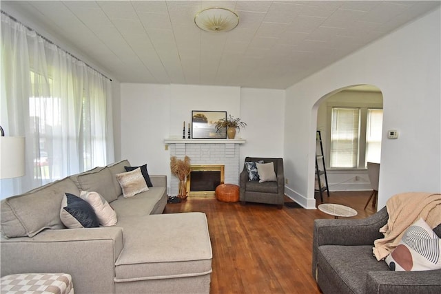 1804 Ridge Ave, Coraopolis, PA 15108 - living area with arched walkways, wood finished floors, and a brick fireplace