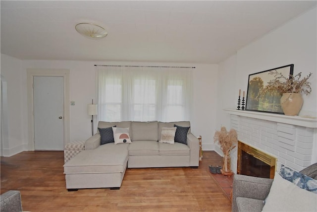 1804 Ridge Ave, Coraopolis, PA 15108 - living area featuring wood finished floors and a brick fireplace
