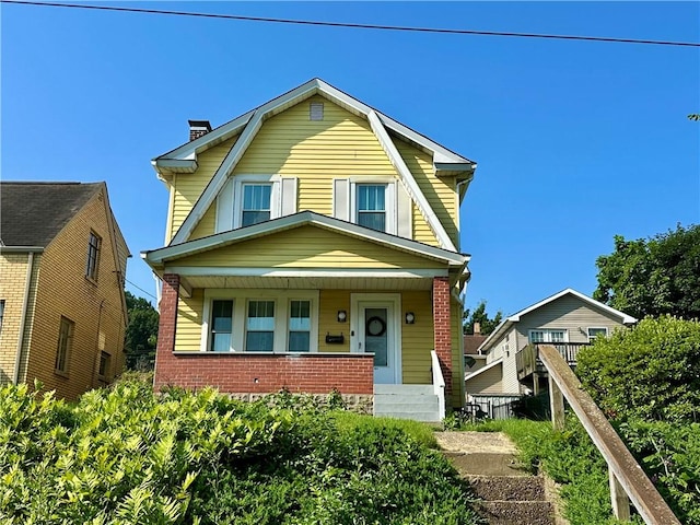 1804 Ridge Ave, Coraopolis, PA 15108 - colonial inspired home with a gambrel roof, a chimney, a porch, and brick siding