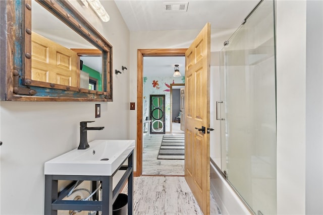 219 Tea Rose Ln, Harrison Twp, PA 15065 - full bath with bath / shower combo with glass door and wood finished floors