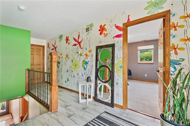 219 Tea Rose Ln, Harrison Twp, PA 15065 - entryway with wallpapered walls and wood finished floors