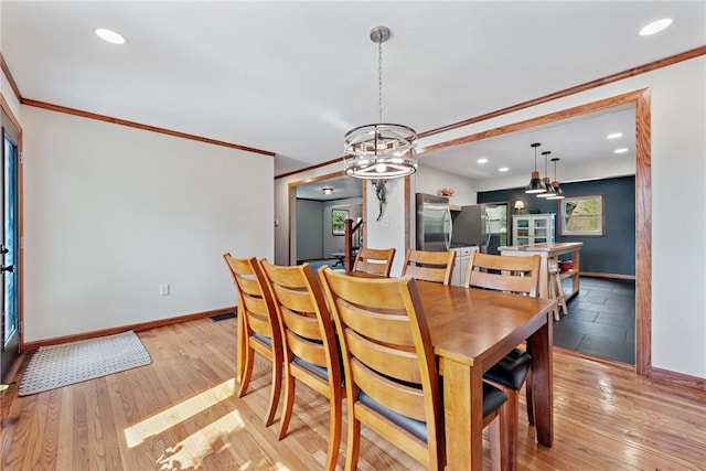 219 Tea Rose Ln, Harrison Twp, PA 15065 - dining space with recessed lighting, ornamental molding, light wood-style flooring, and a chandelier