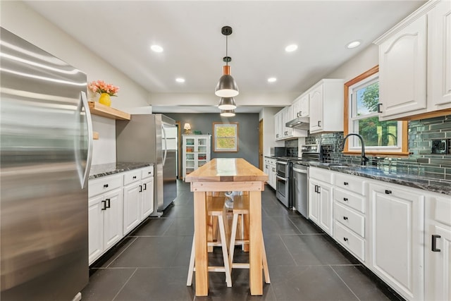 219 Tea Rose Ln, Harrison Twp, PA 15065 - kitchen featuring stainless steel appliances, white cabinets, recessed lighting, backsplash, and under cabinet range hood