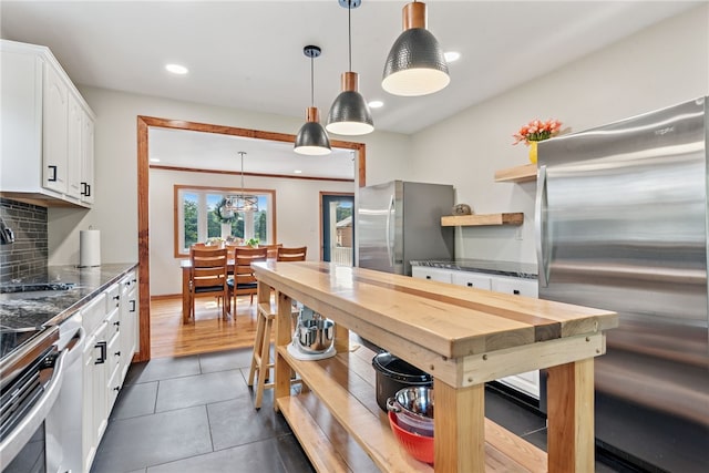 219 Tea Rose Ln, Harrison Twp, PA 15065 - kitchen featuring freestanding refrigerator, open shelves, white cabinets, backsplash, and recessed lighting