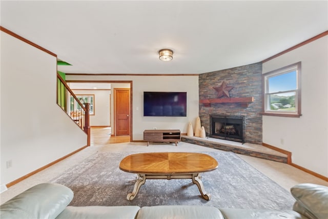 219 Tea Rose Ln, Harrison Twp, PA 15065 - carpeted living area with stairway, a fireplace, and crown molding