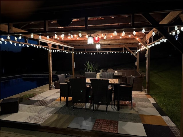 219 Tea Rose Ln, Harrison Twp, PA 15065 - patio at twilight featuring a patio area, outdoor dining area, an outdoor pool, and a pergola