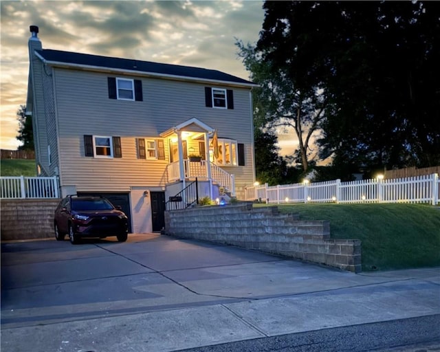 219 Tea Rose Ln, Harrison Twp, PA 15065 - view of front of house featuring an attached garage, driveway, and a chimney