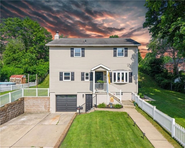 219 Tea Rose Ln, Harrison Twp, PA 15065 - view of front of property featuring an attached garage, concrete driveway, and a chimney