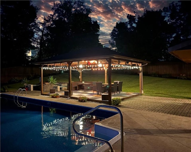 219 Tea Rose Ln, Harrison Twp, PA 15065 - pool at dusk featuring a gazebo and a patio