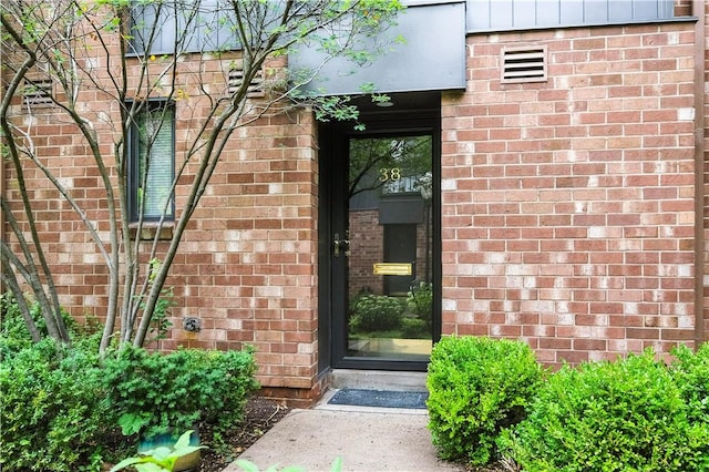 38 Foster Sq, Central North Side, PA 15212 - doorway to property featuring brick siding