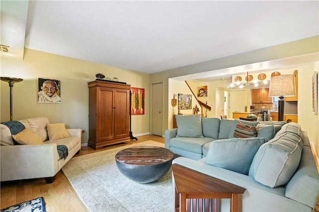 38 Foster Sq, Central North Side, PA 15212 - living area featuring light wood-style floors and baseboards