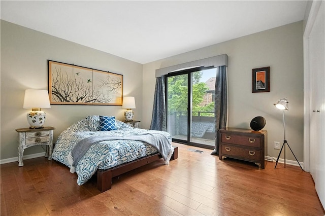 38 Foster Sq, Central North Side, PA 15212 - bedroom featuring access to exterior and hardwood / wood-style floors