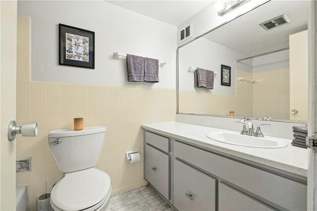 38 Foster Sq, Central North Side, PA 15212 - bathroom with vanity, tile walls, and shower / washtub combination