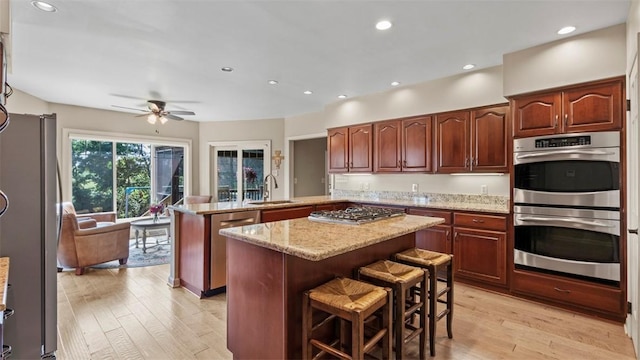 108 Trenton Cir, Peters Twp, PA 15317 - kitchen with stainless steel appliances, a peninsula, light wood-style floors, a center island, and recessed lighting