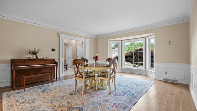108 Trenton Cir, Peters Twp, PA 15317 - dining space with crown molding, a wainscoted wall, wood finished floors, and a decorative wall