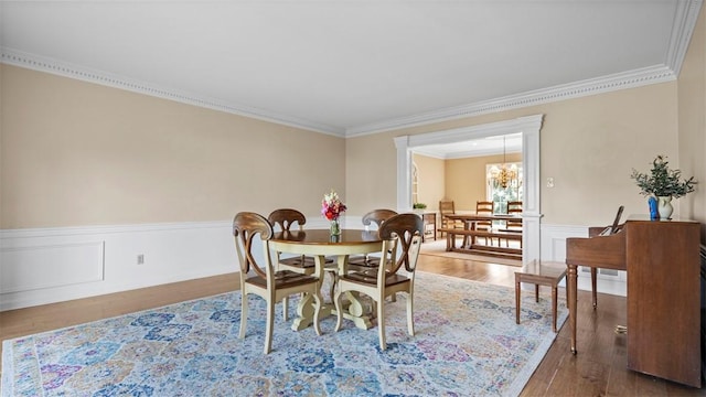 108 Trenton Cir, Peters Twp, PA 15317 - dining space with crown molding, wood finished floors, a chandelier, and a wainscoted wall