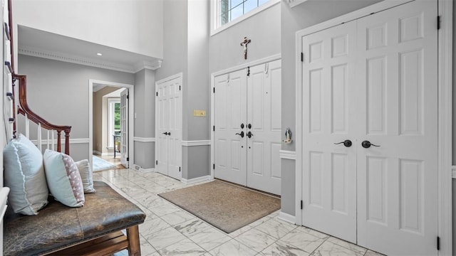 108 Trenton Cir, Peters Twp, PA 15317 - entrance foyer featuring light marble finish flooring, a high ceiling, and ornamental molding