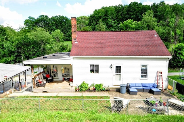 8263 Mentor Rd, Forward Twp, PA 15037 - back of property with a fenced backyard, outdoor lounge area, a chimney, a patio area, and a deck