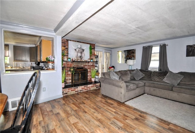 8263 Mentor Rd, Forward Twp, PA 15037 - living room with wood finished floors, a fireplace, and ornamental molding