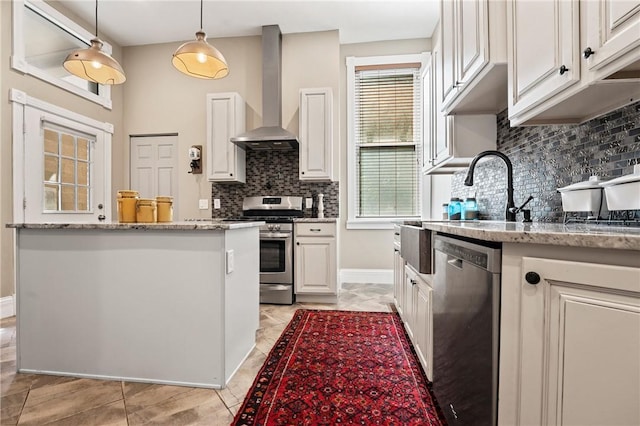 423 Lockhart St, East Allegheny, PA 15212 - kitchen featuring appliances with stainless steel finishes, wall chimney range hood, backsplash, and white cabinets