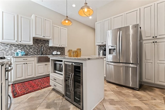 423 Lockhart St, East Allegheny, PA 15212 - kitchen with appliances with stainless steel finishes, beverage cooler, backsplash, a center island, and recessed lighting