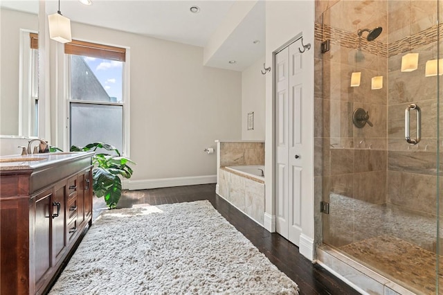 423 Lockhart St, East Allegheny, PA 15212 - bathroom featuring a garden tub, vanity, wood finished floors, a stall shower, and recessed lighting