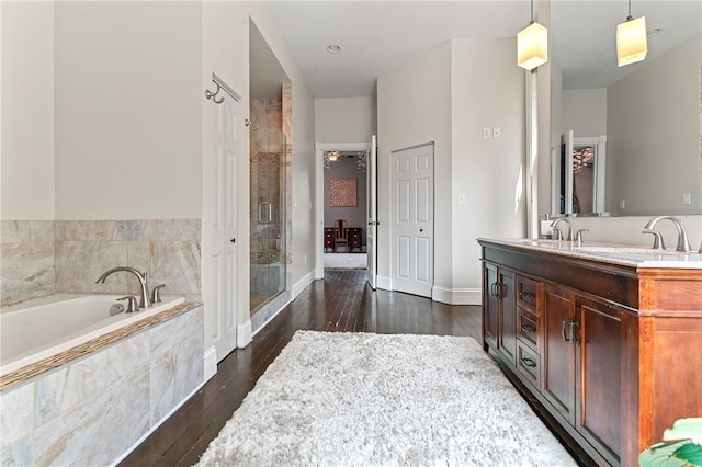 423 Lockhart St, East Allegheny, PA 15212 - full bath featuring a shower stall, wood-type flooring, a bath, and double vanity
