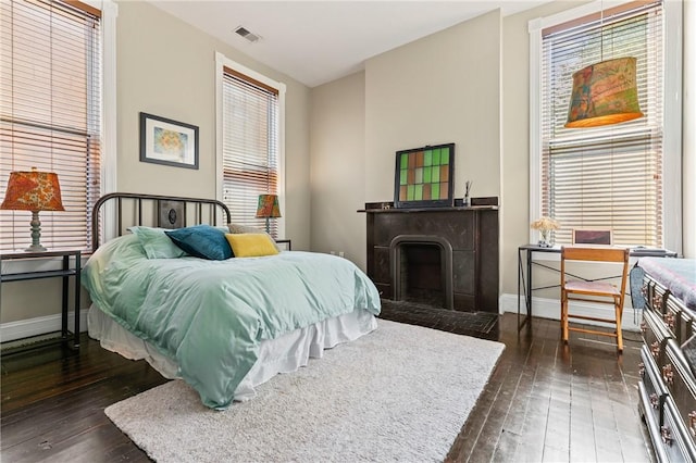 423 Lockhart St, East Allegheny, PA 15212 - bedroom featuring dark wood-style floors and a fireplace