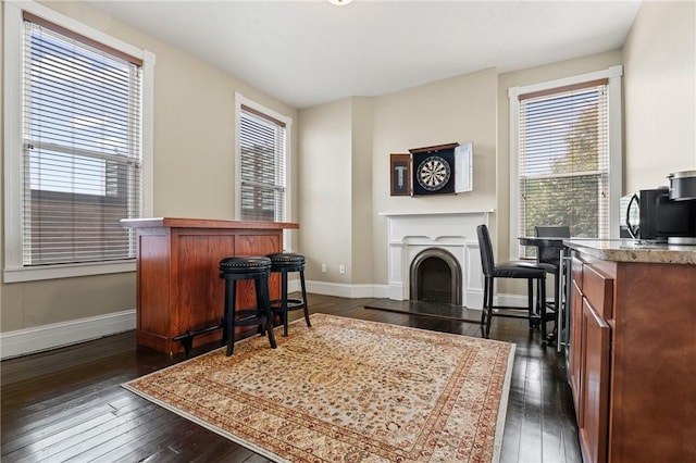 423 Lockhart St, East Allegheny, PA 15212 - living area with dark wood-type flooring and a fireplace with raised hearth