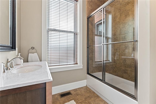 423 Lockhart St, East Allegheny, PA 15212 - full bath with vanity, enclosed tub / shower combo, and plenty of natural light