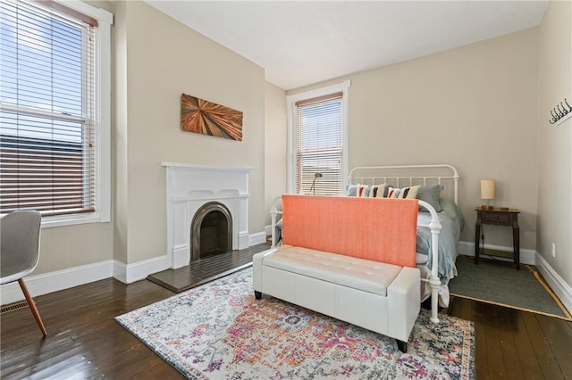 423 Lockhart St, East Allegheny, PA 15212 - bedroom with wood-type flooring and a fireplace with raised hearth