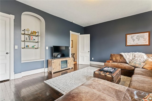 423 Lockhart St, East Allegheny, PA 15212 - living room featuring dark wood-style flooring and arched walkways