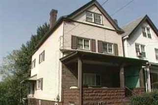 1313 Everett St, Wilkinsburg, PA 15221 - view of front of property with a chimney and a porch