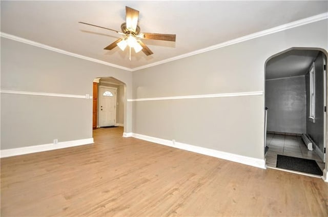145 E Main St, Monongahela, PA 15063 - unfurnished room featuring arched walkways, a ceiling fan, wood finished floors, ornamental molding, and baseboard heating