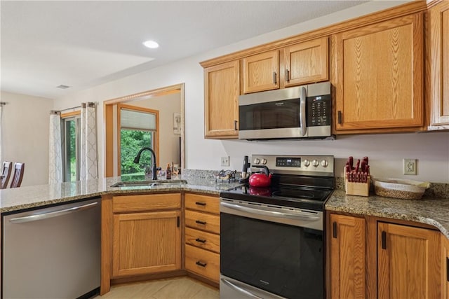 163 Nesbitt Rd, Neshannock Twp, PA 16105 - kitchen featuring stainless steel appliances, light stone counters, a peninsula, and recessed lighting