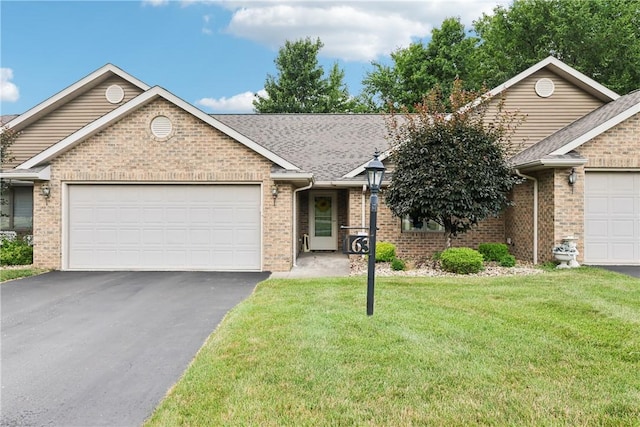 163 Nesbitt Rd, Neshannock Twp, PA 16105 - single story home featuring a garage, brick siding, and asphalt driveway
