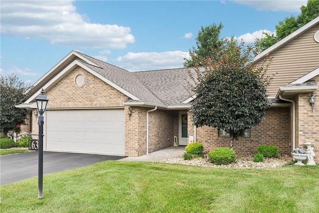 163 Nesbitt Rd, Neshannock Twp, PA 16105 - ranch-style home with brick siding, asphalt driveway, an attached garage, a front yard, and a shingled roof