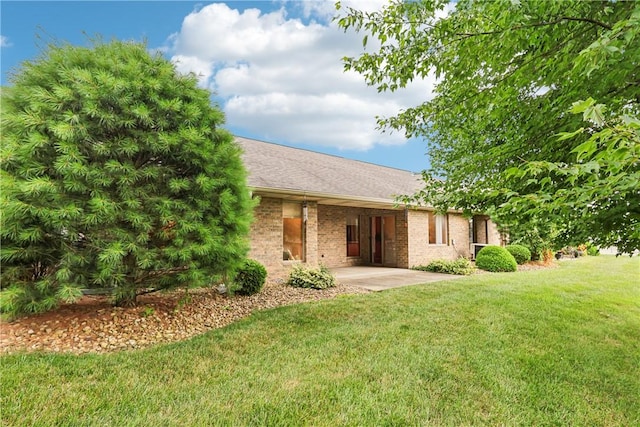 163 Nesbitt Rd, Neshannock Twp, PA 16105 - view of front of home with a patio, a front yard, and brick siding