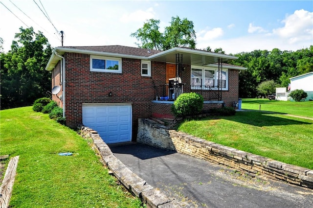 111 Wood St, Rostraver, PA 15089 - view of front of house featuring an attached garage, driveway, brick siding, and a front lawn