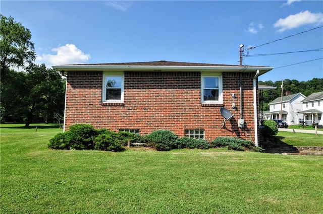 111 Wood St, Rostraver, PA 15089 - view of side of property with a lawn and brick siding